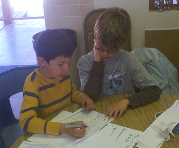 Two male students doing research