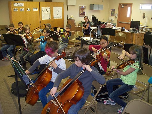Borton's Orchestra rehearsing violins in the classroom