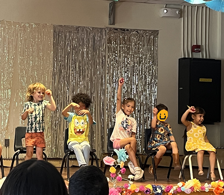Students perform on stage