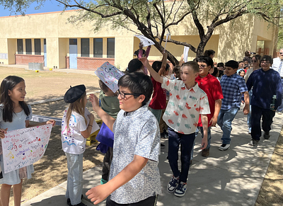 5th graders cheered on by the rest of the school
