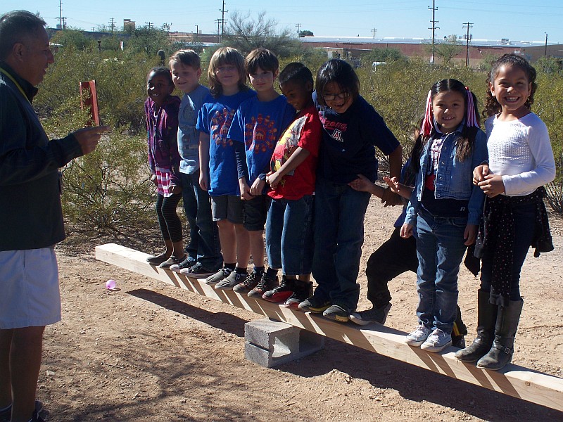students on a teeter totter