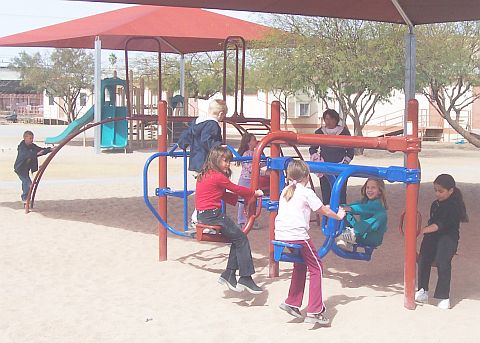 Children playing on playground equipment